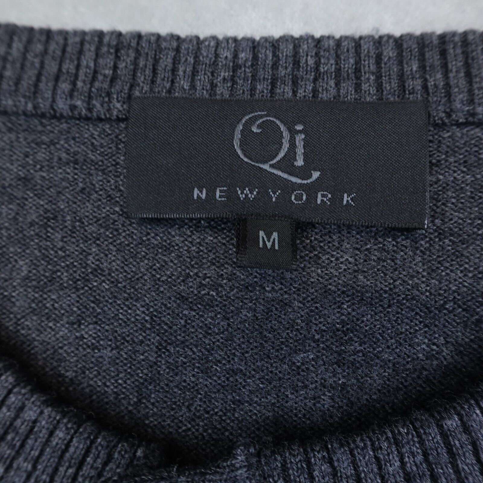 Qi Sweaters